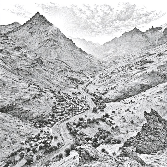 A valley seen from a mountain summit, a road winding through the village below