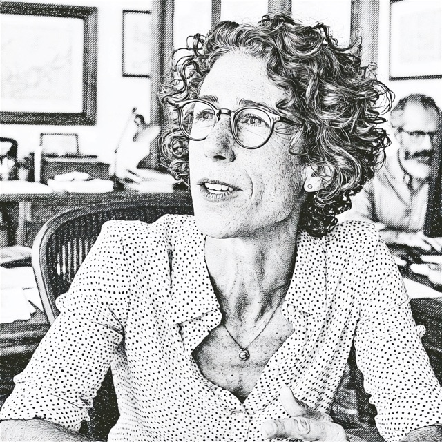 An expert in conversation across her desk, listening